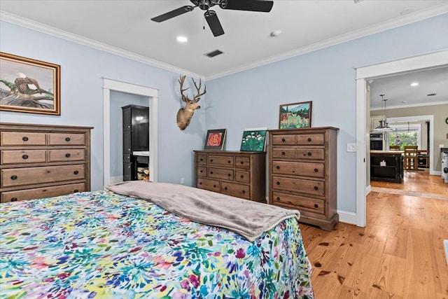 3195 Singletary Rd, Slocomb, AL 36375 - bedroom featuring light wood-type flooring, ornamental molding, recessed lighting, connected bathroom, and a ceiling fan