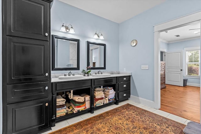 3195 Singletary Rd, Slocomb, AL 36375 - full bath featuring double vanity, tile patterned floors, and ornamental molding