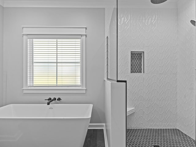 full bathroom with a tile shower and a soaking tub