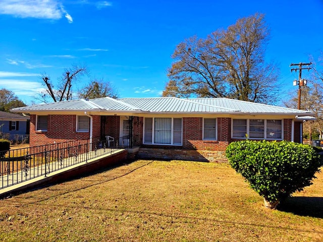 ranch-style home with a front lawn