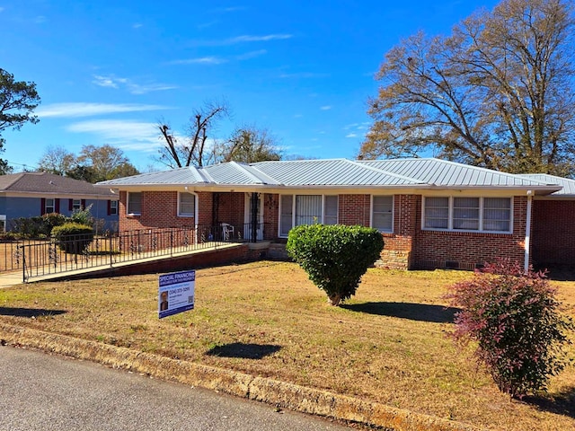 ranch-style house featuring a front lawn