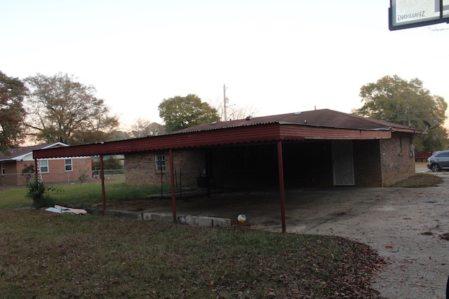 rear view of house featuring a carport