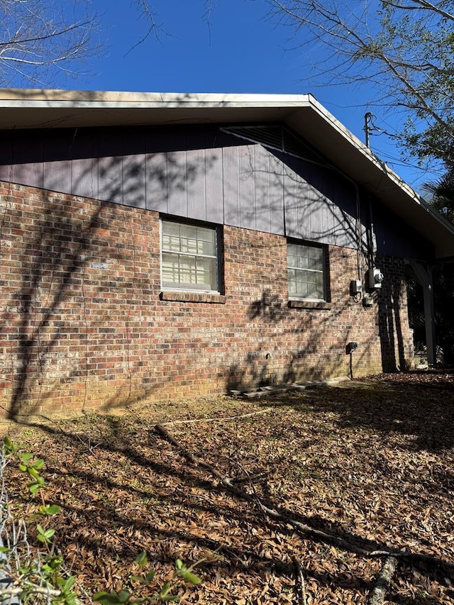 view of home's exterior with brick siding