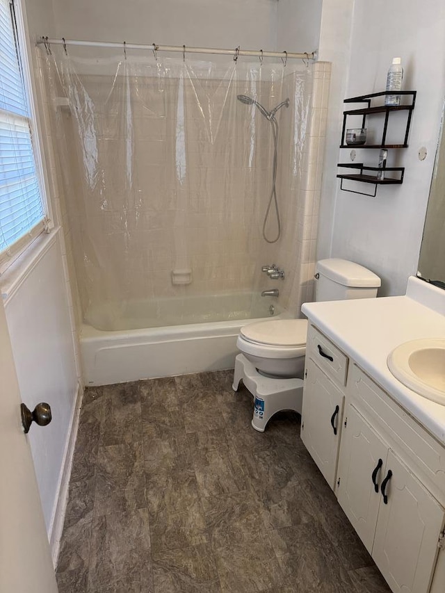 full bathroom with toilet, shower / tub combo, and vanity