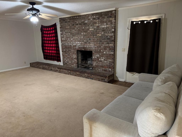 carpeted living room featuring ornamental molding, a brick fireplace, and baseboards