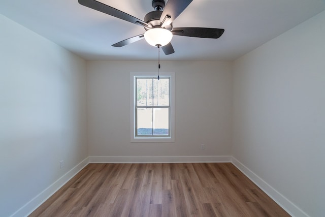 unfurnished room featuring light wood-style flooring and baseboards