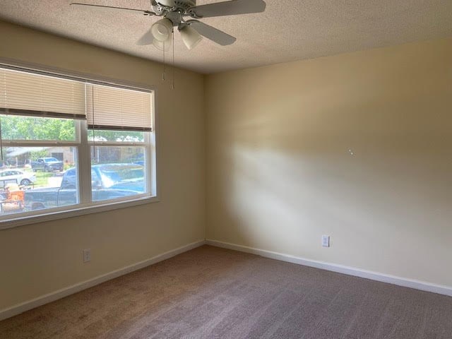 2308 Debbie Dr, Dothan, AL 36301 - carpeted empty room featuring a textured ceiling and ceiling fan