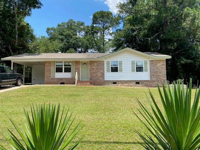 2308 Debbie Dr, Dothan, AL 36301 - ranch-style home with crawl space, a front yard, an attached carport, and brick siding