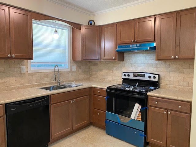 2308 Debbie Dr, Dothan, AL 36301 - kitchen with dishwasher, under cabinet range hood, range with electric cooktop, light countertops, and ornamental molding