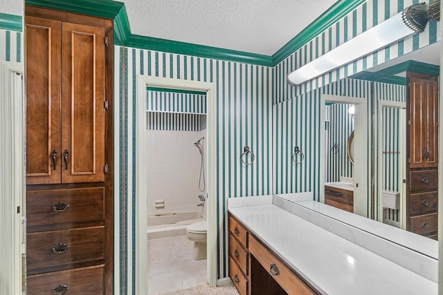 bathroom featuring vanity, a textured ceiling, wallpapered walls, and toilet