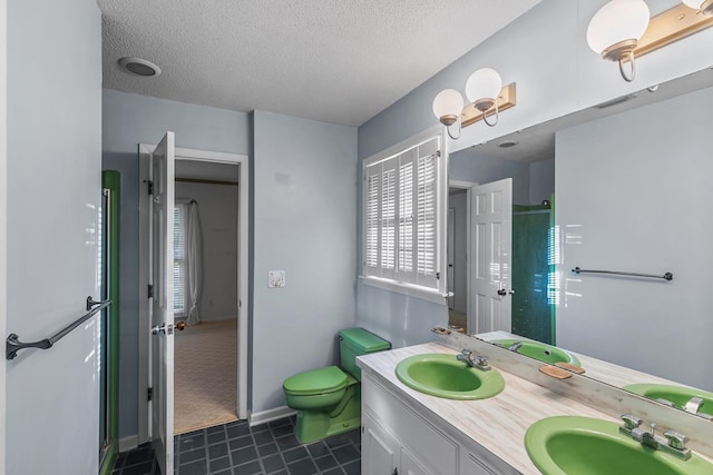 full bathroom with a sink, toilet, tile patterned flooring, and a stall shower
