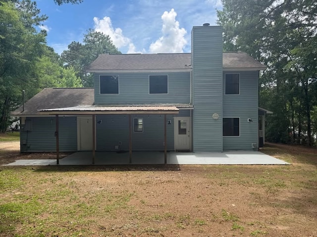 107 Comanche Cir, Enterprise, AL 36330 - back of house featuring a patio, a yard, and a chimney
