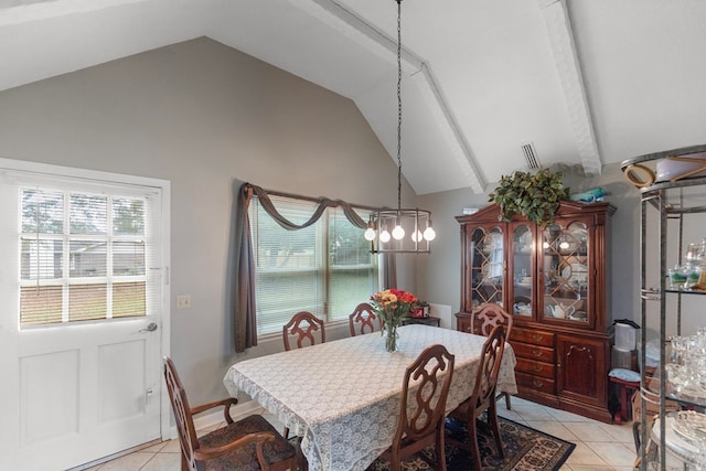 tiled dining room with beam ceiling and high vaulted ceiling