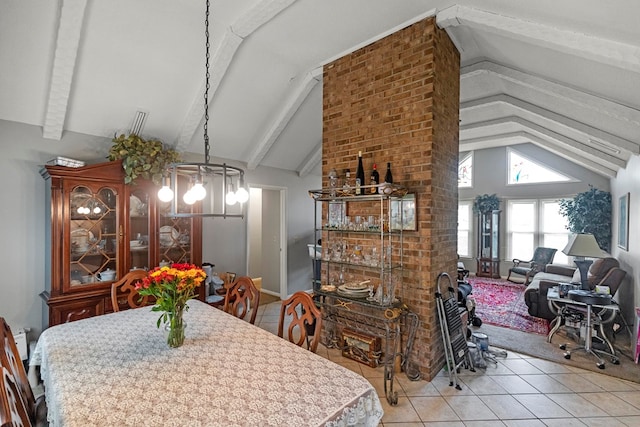 tiled dining area featuring vaulted ceiling with beams and a chandelier