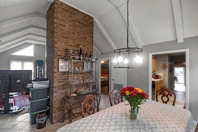 tiled dining area featuring plenty of natural light, lofted ceiling with beams, and an inviting chandelier