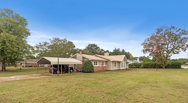 view of front facade featuring a carport and a front lawn