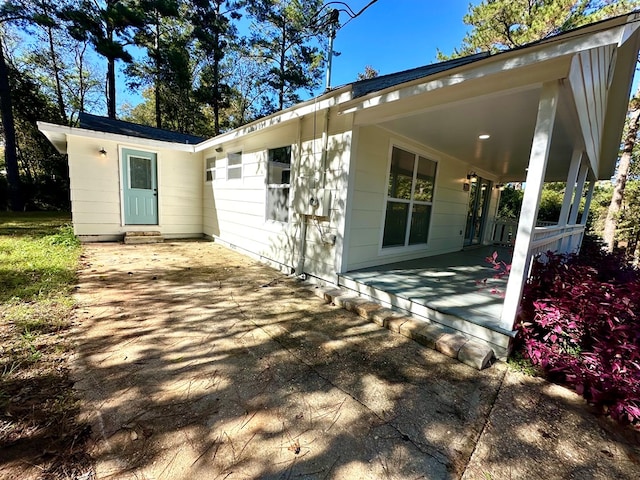 rear view of house featuring a patio area