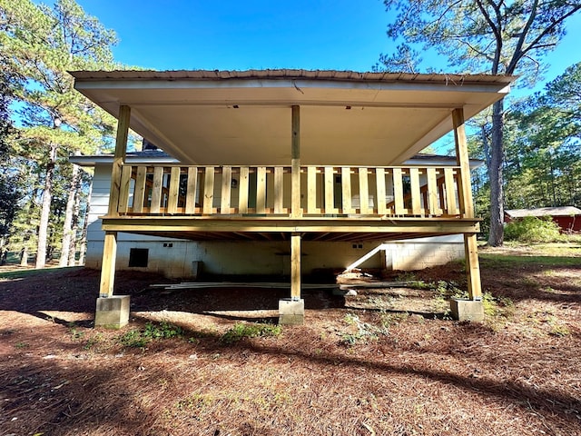 rear view of house with a wooden deck