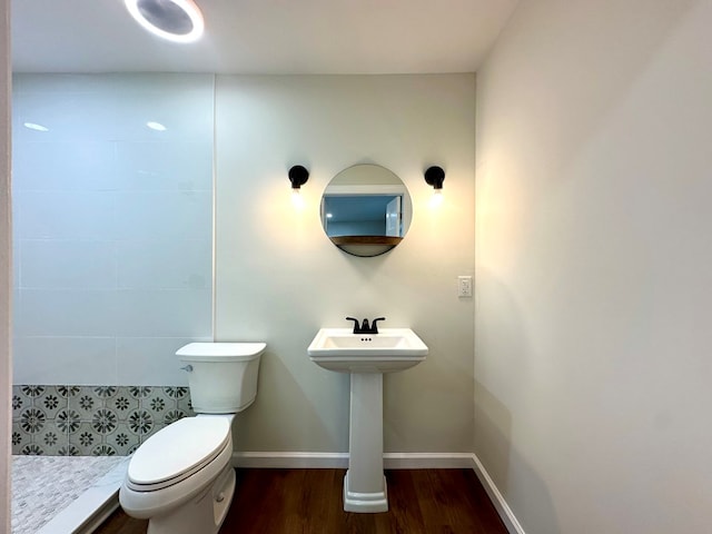 bathroom featuring hardwood / wood-style floors, toilet, and sink