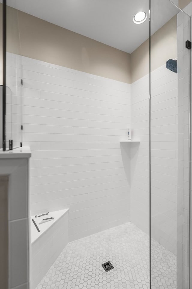 bathroom with tiled shower