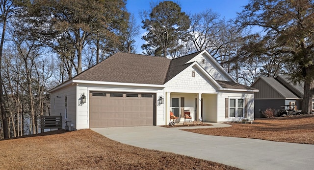 view of front of property with a garage and a porch