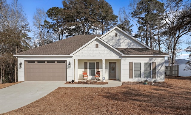 view of front of property featuring a garage and covered porch