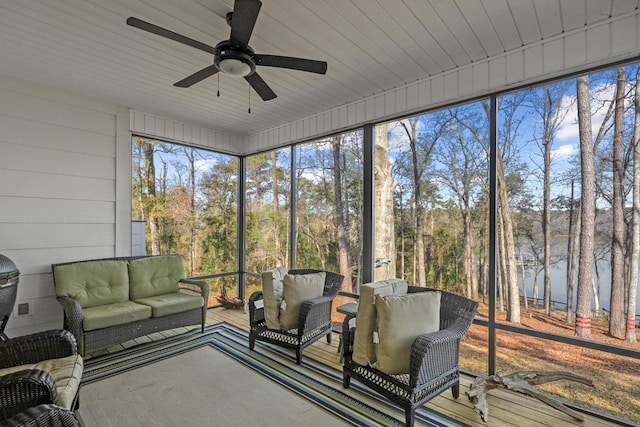 sunroom / solarium featuring wooden ceiling and ceiling fan