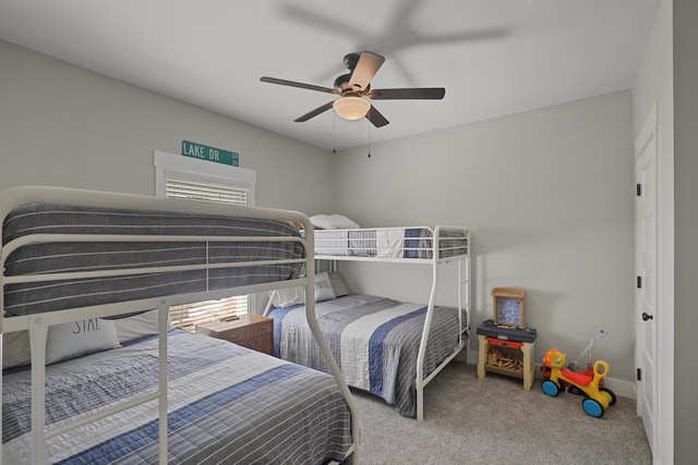 carpeted bedroom featuring ceiling fan