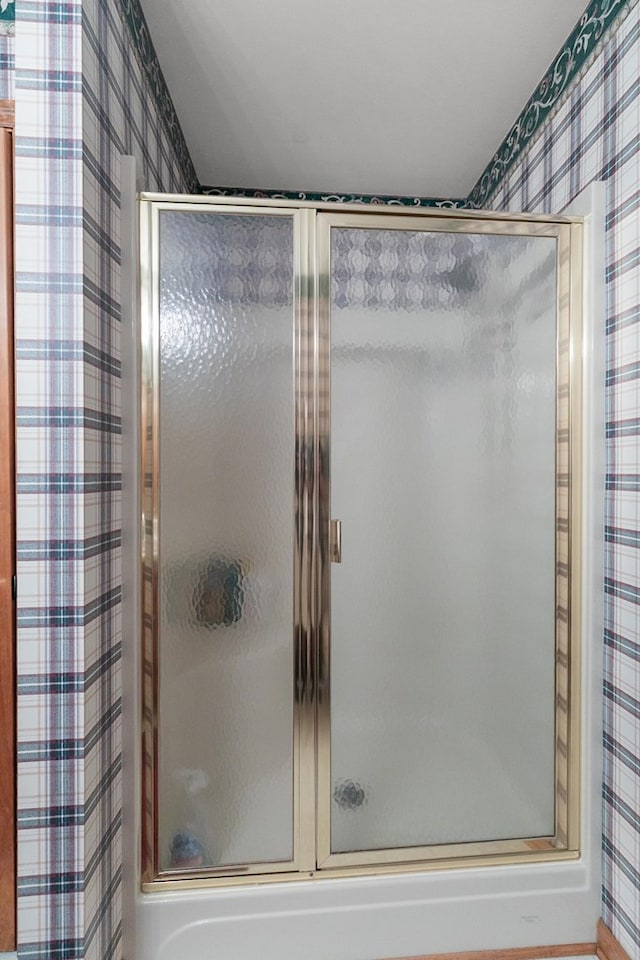 876 Boat Landing Rd, Gordon, AL 36343 - full bathroom with wallpapered walls and a shower with shower door