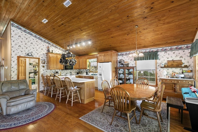 876 Boat Landing Rd, Gordon, AL 36343 - dining room with wallpapered walls, lofted ceiling, wood ceiling, a chandelier, and wood finished floors