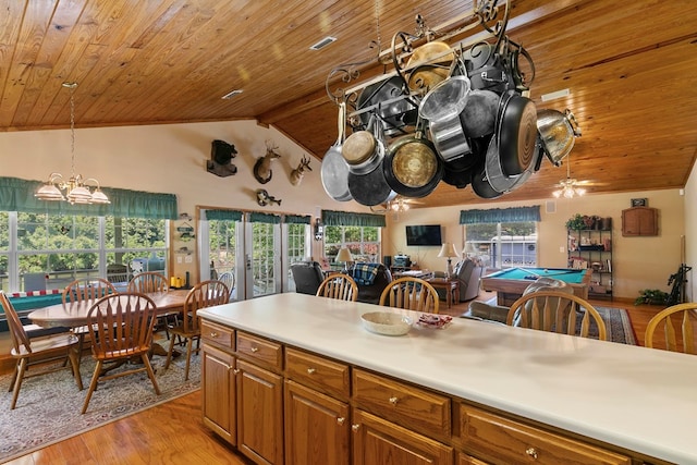 876 Boat Landing Rd, Gordon, AL 36343 - kitchen with wooden ceiling, brown cabinetry, light wood-type flooring, billiards table, and decorative light fixtures