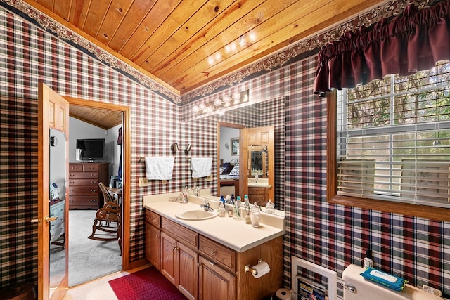 876 Boat Landing Rd, Gordon, AL 36343 - bathroom with wallpapered walls, lofted ceiling, wood ceiling, vanity, and toilet