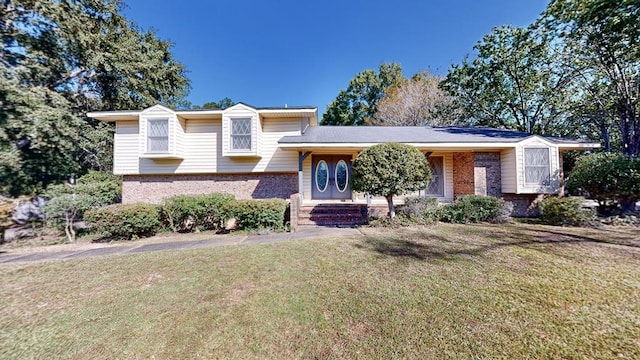 tri-level home with a front yard