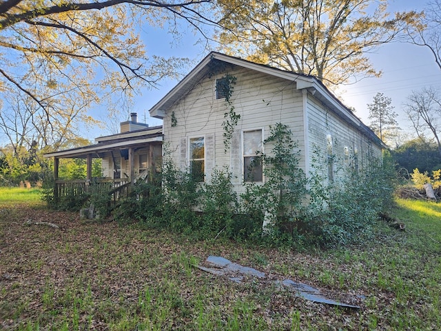 view of home's exterior with covered porch