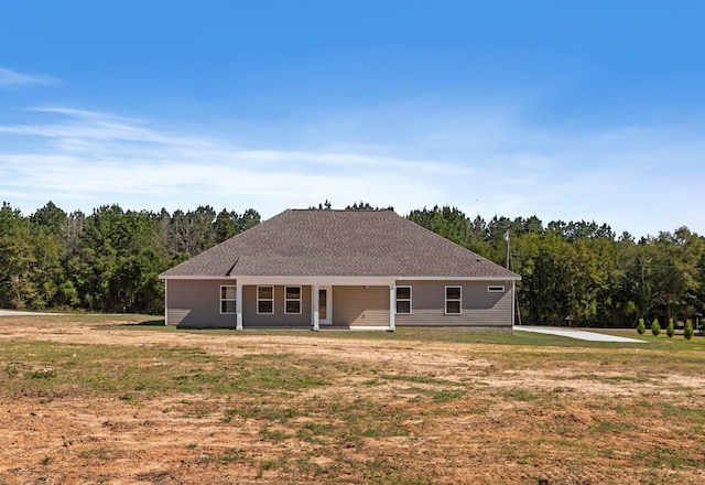 view of front of house featuring a front yard and covered porch