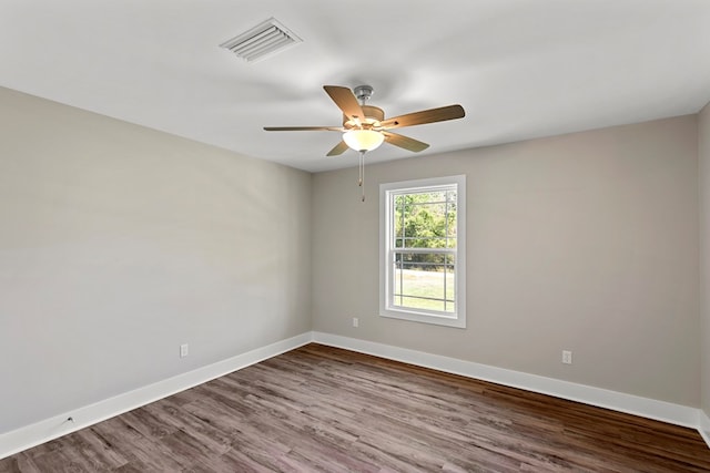 unfurnished room with hardwood / wood-style flooring and ceiling fan