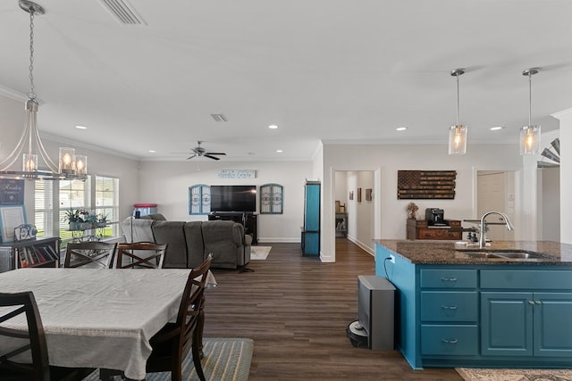 318 Oconee Dr, Midland City, AL 36350 - dining area with ceiling fan, crown molding, a chandelier, recessed lighting, and dark wood-type flooring