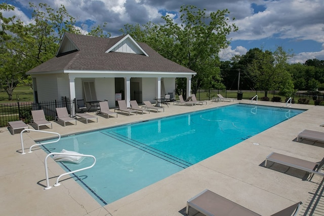 318 Oconee Dr, Midland City, AL 36350 - community pool with a patio, fence, an outbuilding, and view of scattered trees