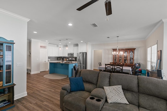 318 Oconee Dr, Midland City, AL 36350 - living room featuring a ceiling fan, ornamental molding, a chandelier, recessed lighting, and dark wood-style floors