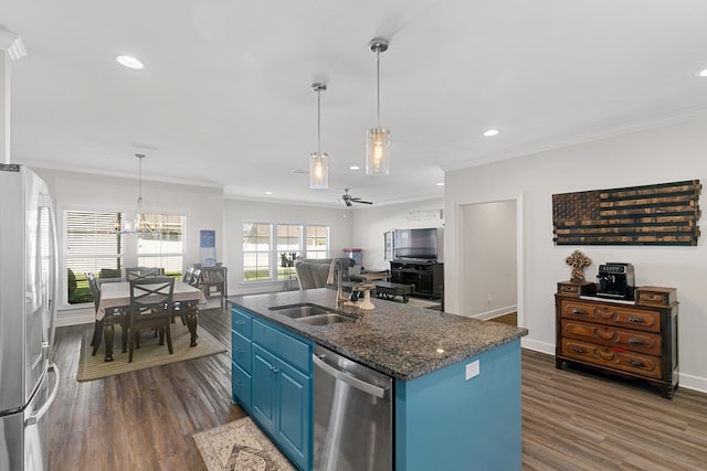 318 Oconee Dr, Midland City, AL 36350 - kitchen featuring stainless steel appliances, blue cabinets, a sink, ornamental molding, and dark wood-type flooring