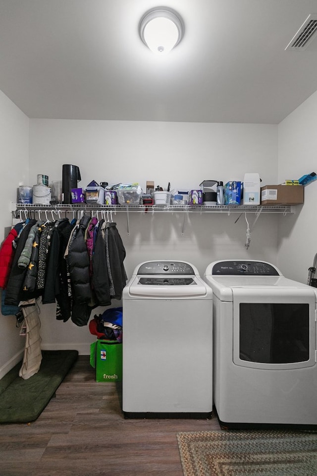 318 Oconee Dr, Midland City, AL 36350 - washroom with washing machine and dryer and wood finished floors