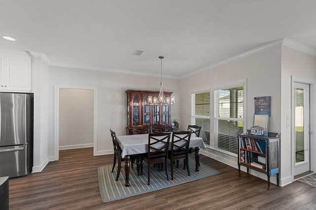 318 Oconee Dr, Midland City, AL 36350 - dining area featuring dark wood-style flooring, baseboards, ornamental molding, and a chandelier