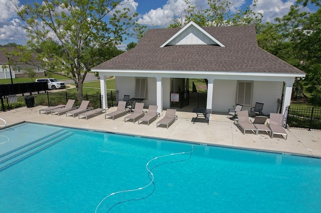 318 Oconee Dr, Midland City, AL 36350 - community pool with a patio area, fence, an outbuilding, and a storage structure