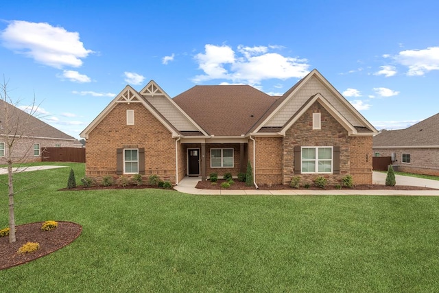 craftsman-style home featuring a front lawn