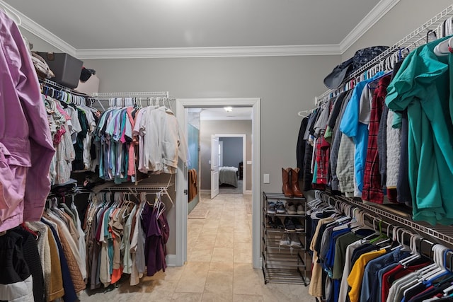 spacious closet with light tile patterned flooring