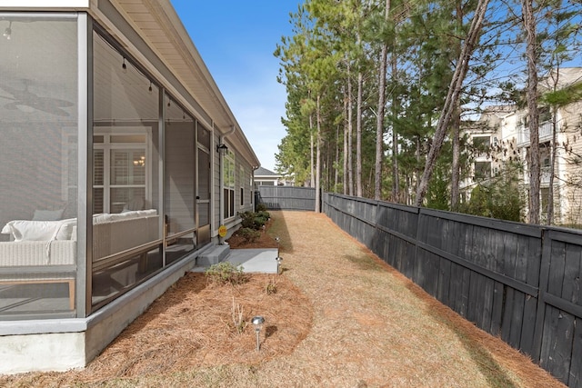 view of yard with a sunroom