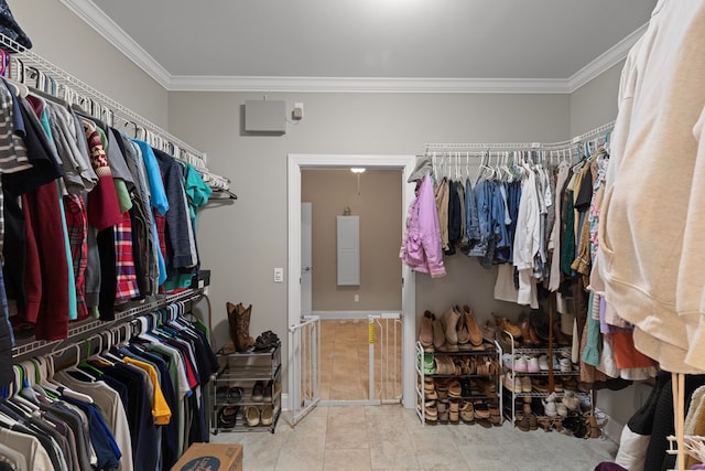 walk in closet with light tile patterned floors