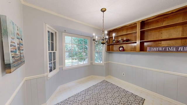 2104 Centenial Dr, Dothan, AL 36303 - unfurnished dining area featuring a chandelier, crown molding, tile patterned floors, a textured ceiling, and wainscoting