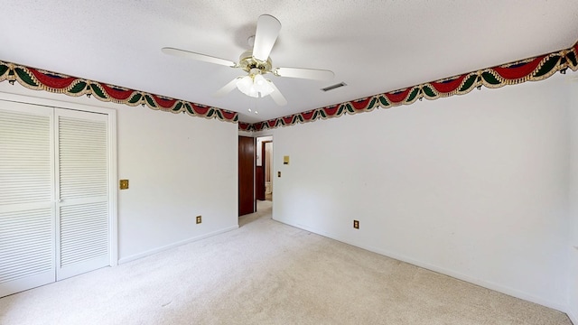 2104 Centenial Dr, Dothan, AL 36303 - unfurnished bedroom featuring carpet floors, a closet, a ceiling fan, and a textured ceiling