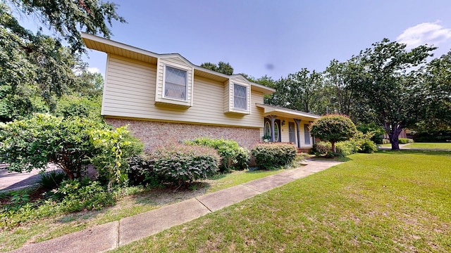 2104 Centenial Dr, Dothan, AL 36303 - tri-level home with brick siding and a front lawn